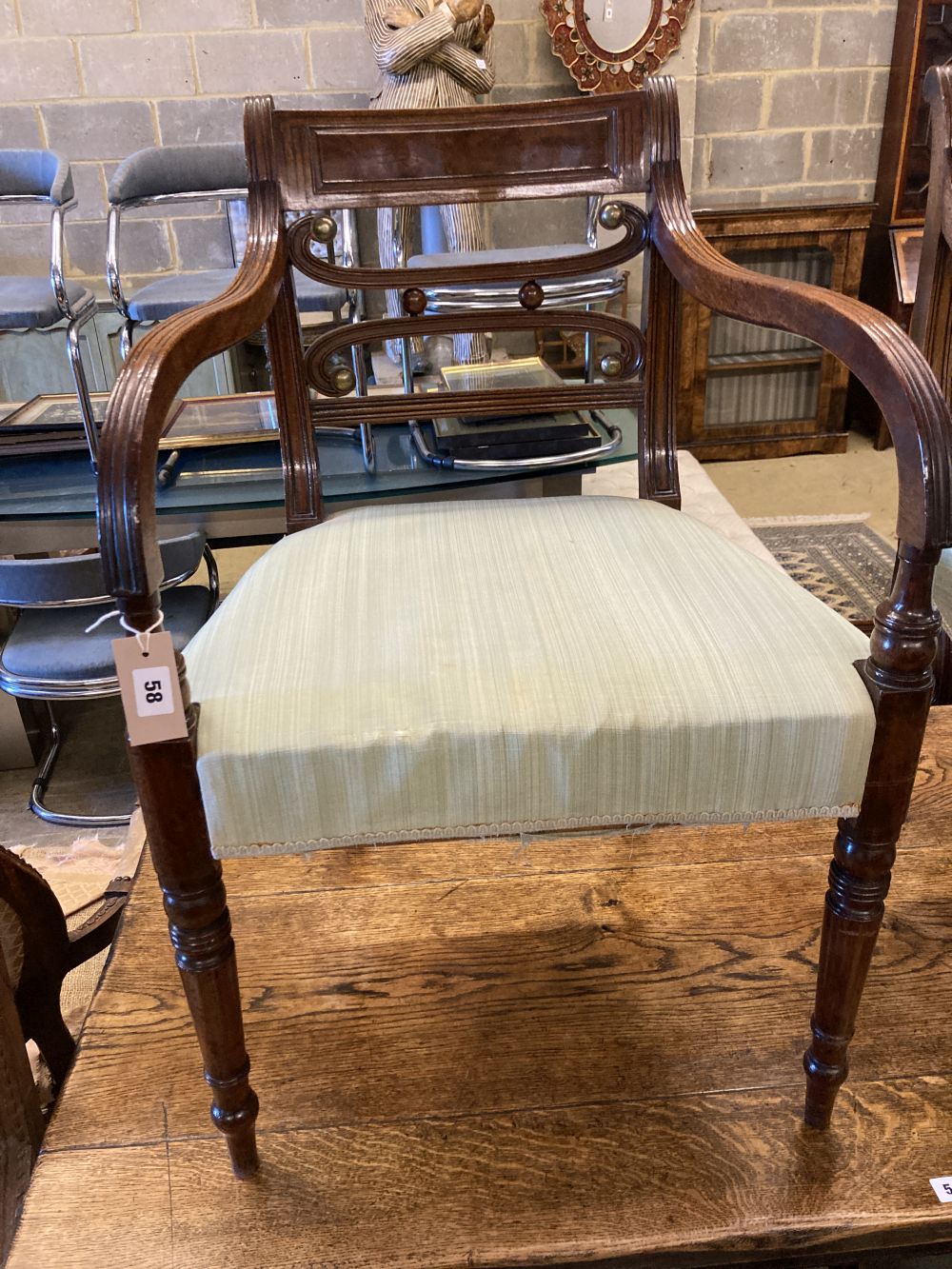 A set of eight Regency mahogany dining chairs (two with arms)